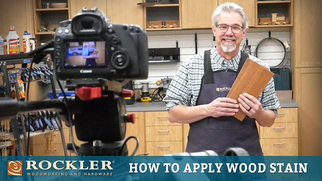 Rob Johnstone displaying applied wood stain