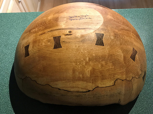 Cracked bowl repaired with butterfly inlay