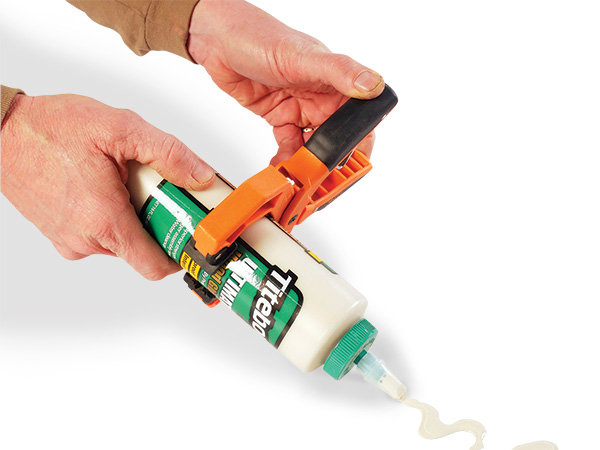 Using a clamp to squeeze glue bottle