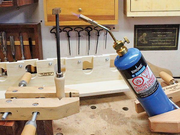 Heating branding iron with propane torch