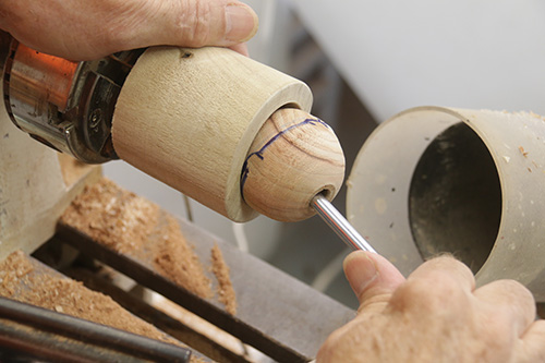 Pulling ornament turning out of cup chuck