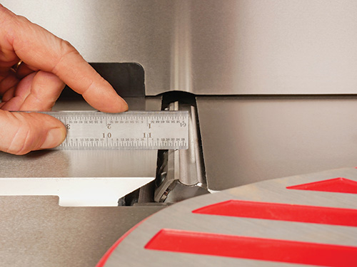 Measuring jointer outfeed table against cutterhead