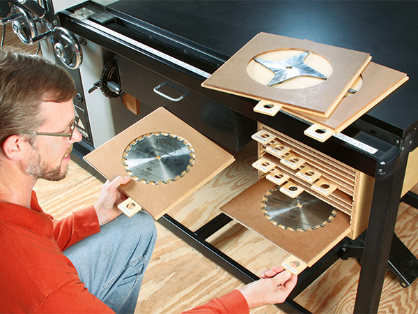 Storing saw blades under table saw cabinet