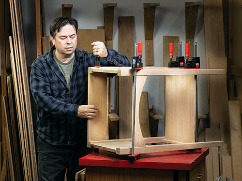 Attaching front and back portions of serving table frame