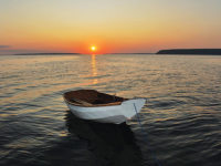 Hand-crafted boat on open water