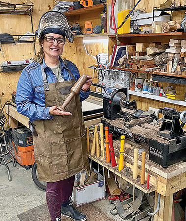 Veteran woodworker showing off turned mallet