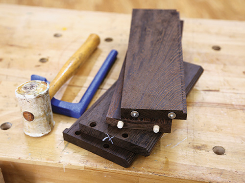 Dowels installed on edges of wine cabinet frame pieces